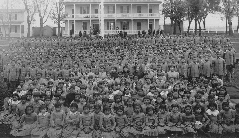 Photo of student body assembled on the Carlisle Indian School grounds